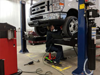 Mechanic Working on Bus
