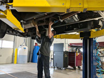 Mechanic Working on Bus